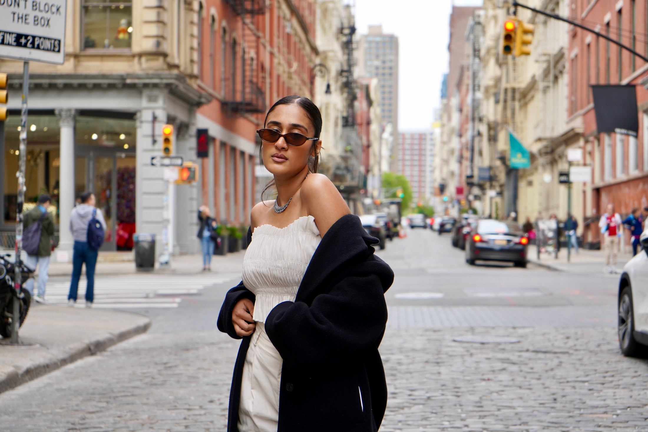 Raagini Gupta standing in a New York City street editorial portrait