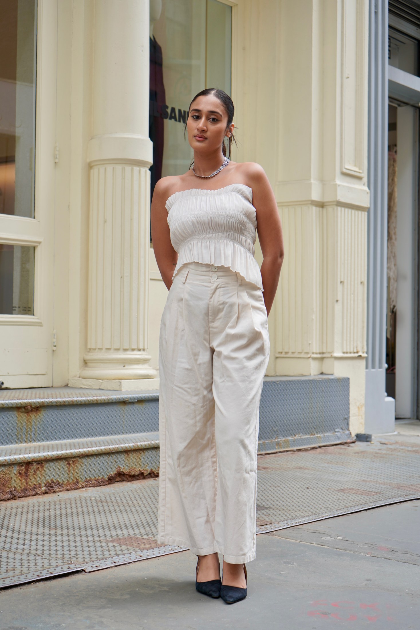 Full body editorial portrait of Raagini Gupta in a white outfit