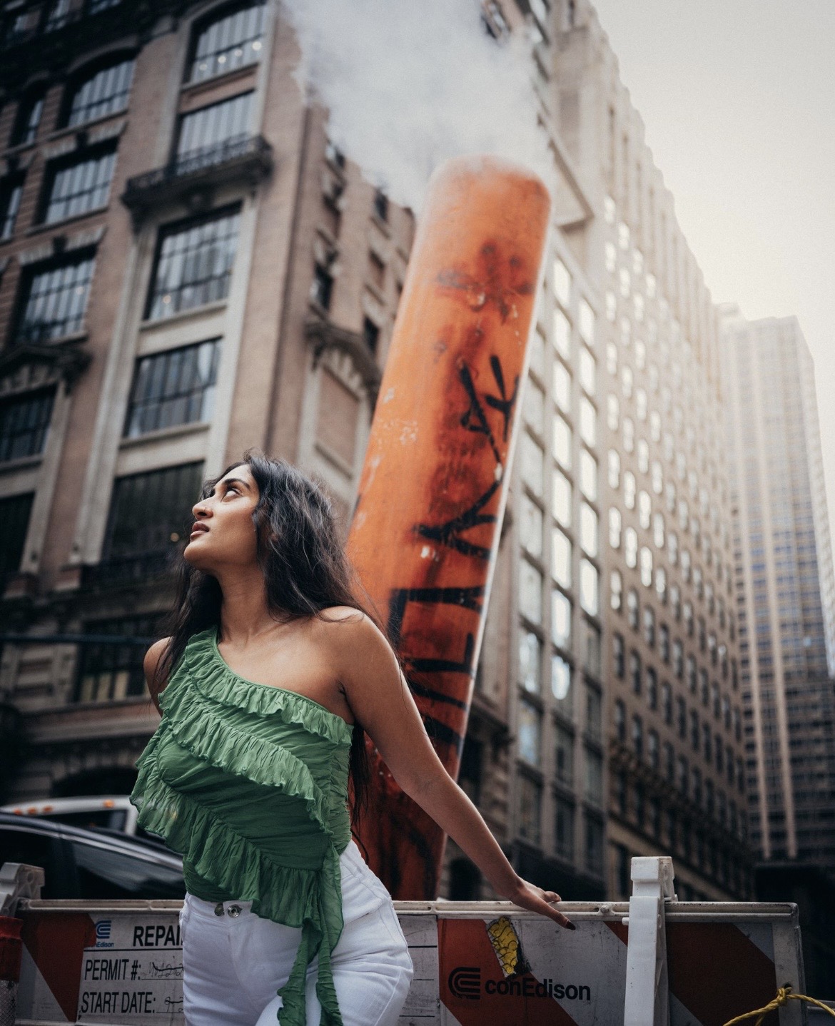 Raagini Gupta modeling in a green top near Bryant Park in New York City