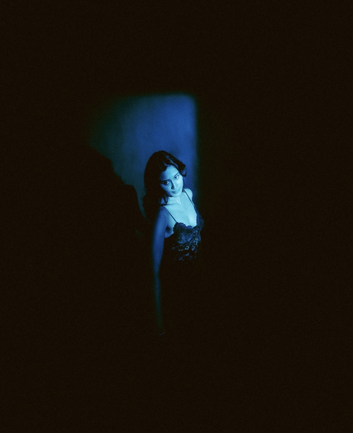 Raagini Gupta editorial portrait in blue shadow lighting