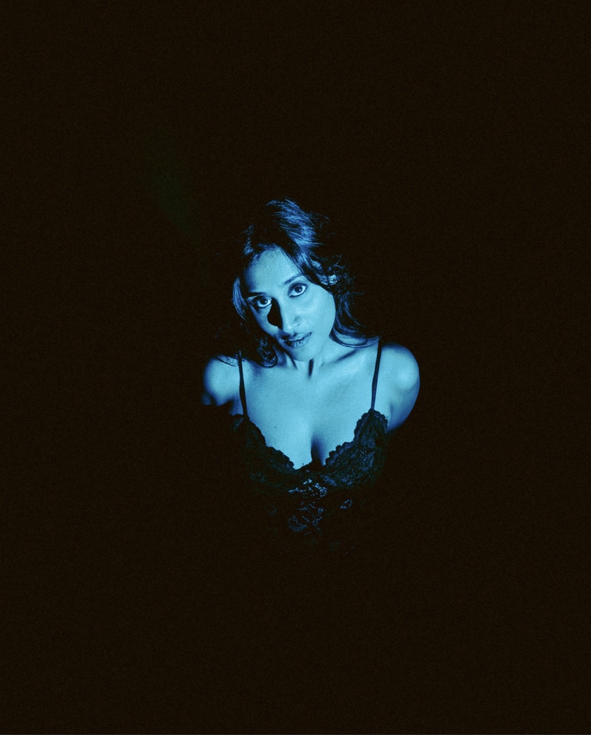 Raagini Gupta close portrait in blue light and shadow