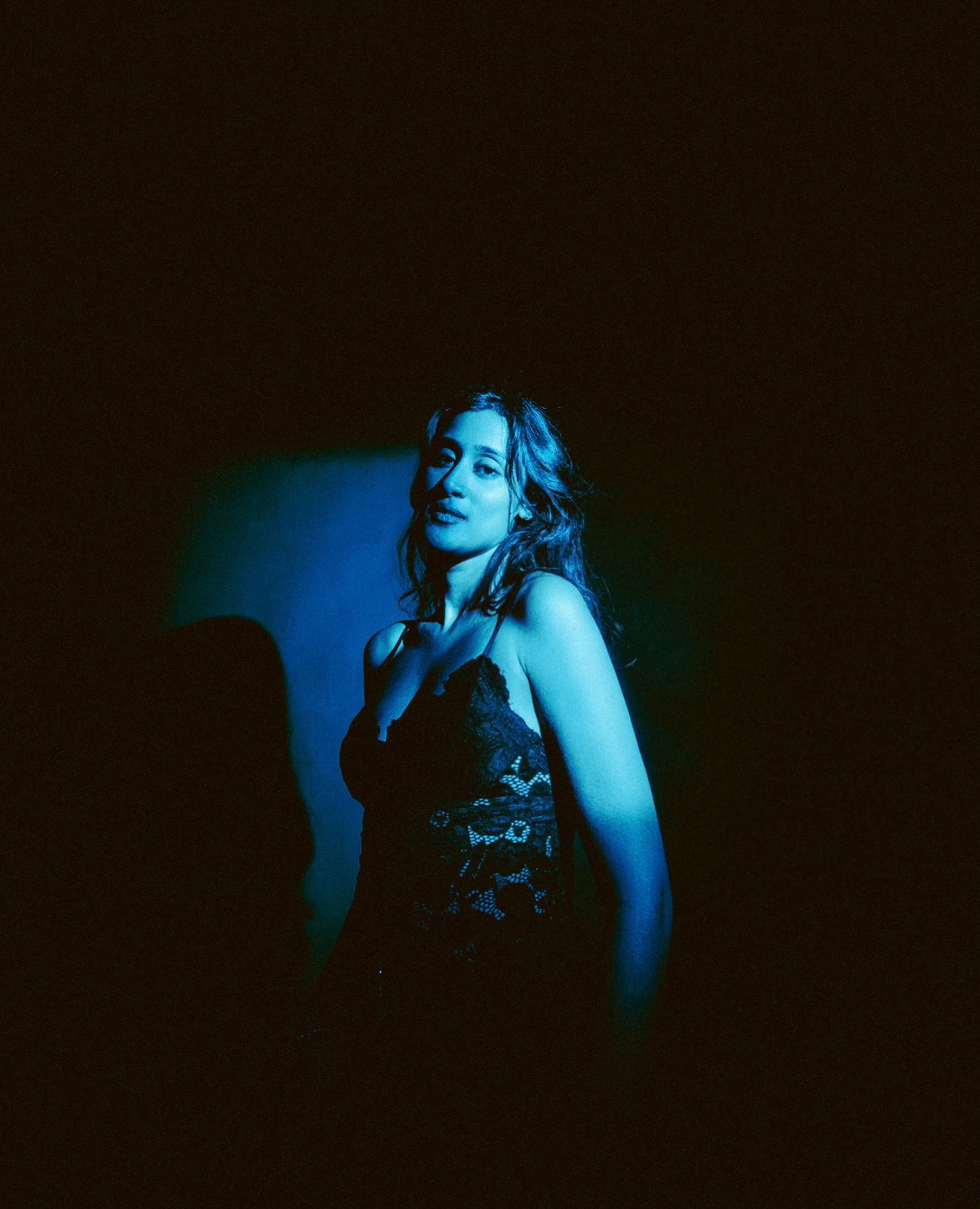 Raagini Gupta editorial portrait in red and blue light